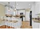Well-lit kitchen with granite countertops, black appliances and ample cabinet space at 421 30Th Ave. S, Sunset Beach, NC 28468