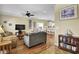 Bright living room with hardwood floors, ceiling fan, and comfortable seating area at 421 30Th Ave. S, Sunset Beach, NC 28468