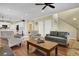 Bright living room with hardwood floors offering an open view to the kitchen and dining area at 421 30Th Ave. S, Sunset Beach, NC 28468