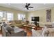 Inviting living room with natural light, a ceiling fan and cozy furnishings at 421 30Th Ave. S, Sunset Beach, NC 28468