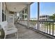 Spacious screened-in porch with comfortable seating, ideal for relaxation and enjoying the outdoors at 421 30Th Ave. S, Sunset Beach, NC 28468