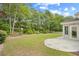 Landscaped backyard with a swing and decorative stone patio at 4554 Fringetree Dr., Murrells Inlet, SC 29576