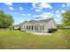 Rear exterior showcasing the yard, patio and white siding at 4554 Fringetree Dr., Murrells Inlet, SC 29576