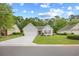 Traditional home featuring a two-car garage and manicured front lawn at 4554 Fringetree Dr., Murrells Inlet, SC 29576