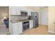 Bright kitchen features stainless steel appliances, granite counters, and white cabinetry at 4554 Fringetree Dr., Murrells Inlet, SC 29576