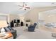 Open-concept living room with fireplace, media center, and seamless transition to the kitchen and dining area at 4554 Fringetree Dr., Murrells Inlet, SC 29576