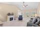 Spacious living room with cozy fireplace, ceiling fan, and comfortable seating, perfect for relaxation at 4554 Fringetree Dr., Murrells Inlet, SC 29576