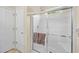 Bright bathroom featuring a tiled shower with clear glass doors and a modern shower head at 4554 Fringetree Dr., Murrells Inlet, SC 29576