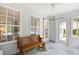 Bright sunroom with bench seating, lots of windows and access to the exterior of the house at 4554 Fringetree Dr., Murrells Inlet, SC 29576