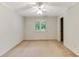 Empty bedroom with neutral carpet, white trim, and ceiling fan at 469 White Heron Ct. Sw, Sunset Beach, NC 28468