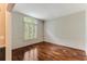 Spacious empty room featuring wood floors, large windows and trim work at 469 White Heron Ct. Sw, Sunset Beach, NC 28468
