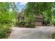 Home featuring attached garage, back deck, and beautiful landscaping at 469 White Heron Ct. Sw, Sunset Beach, NC 28468