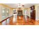 Spacious living room featuring hardwood floors, fireplace, and french doors to outside at 469 White Heron Ct. Sw, Sunset Beach, NC 28468