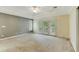Bright main bedroom with tray ceiling, and French doors leading to the outdoors at 469 White Heron Ct. Sw, Sunset Beach, NC 28468