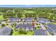 Aerial view of condo community with golf course, ponds, and lush landscaping; a peaceful and scenic living environment at 4846 Carnation Circle # 301, Myrtle Beach, SC 29577