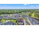 Aerial view of community condos overlooking a golf course, ponds, and the city skyline at 4846 Carnation Circle # 301, Myrtle Beach, SC 29577