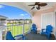 This relaxing balcony, with ceiling fan and blue chairs, offers outdoor enjoyment with views of the beautiful community at 4846 Carnation Circle # 301, Myrtle Beach, SC 29577