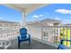This private balcony, with blue chairs, offers a relaxing outdoor space, perfect for enjoying the surrounding community at 4846 Carnation Circle # 301, Myrtle Beach, SC 29577