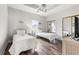 Bright bedroom featuring two twin beds, ceiling fan, and closet with mirrored doors, creating a cozy retreat at 4846 Carnation Circle # 301, Myrtle Beach, SC 29577