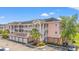 Charming multi-story condo building featuring classic architecture, private balconies and convenient garage parking at 4846 Carnation Circle # 301, Myrtle Beach, SC 29577