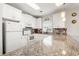 Well-equipped kitchen with white appliances, ample counter space, and tile backsplash at 4846 Carnation Circle # 301, Myrtle Beach, SC 29577