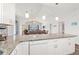 Stylish kitchen open to living area, boasting granite counters, white cabinets, and modern lighting at 4846 Carnation Circle # 301, Myrtle Beach, SC 29577