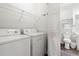 Functional laundry area with modern washer and dryer next to a half bathroom at 4846 Carnation Circle # 301, Myrtle Beach, SC 29577