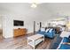 Bright, open living area features wood floors, modern furnishings, and access to the dining area at 4846 Carnation Circle # 301, Myrtle Beach, SC 29577