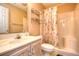 This bathroom features a single vanity, a decorative shower curtain, and storage shelves at 5050 Windsor Green Way # 203, Myrtle Beach, SC 29579