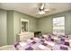 This comfortable bedroom features two twin beds, a dresser, and a bright window at 5050 Windsor Green Way # 203, Myrtle Beach, SC 29579