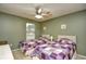 Bedroom featuring two twin beds, a ceiling fan, and a window with natural light at 5050 Windsor Green Way # 203, Myrtle Beach, SC 29579