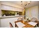 Dining area with wood table next to the kitchen at 5050 Windsor Green Way # 203, Myrtle Beach, SC 29579