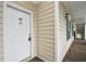 Inviting entryway featuring a white front door with a brass knocker at 5050 Windsor Green Way # 203, Myrtle Beach, SC 29579