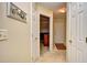 Bright hallway with neutral carpet, a view of the entryway, and storage at 5050 Windsor Green Way # 203, Myrtle Beach, SC 29579