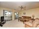 Inviting living room with a ceiling fan, a sliding glass door, and comfortable seating at 5050 Windsor Green Way # 203, Myrtle Beach, SC 29579
