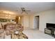 Open-concept living room adjacent to kitchen and dining area at 5050 Windsor Green Way # 203, Myrtle Beach, SC 29579