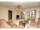 Relaxing living room featuring plush sofas and a balcony at 5050 Windsor Green Way # 203, Myrtle Beach, SC 29579