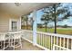 This covered patio has golf course views and outdoor seating to relax and unwind at 5050 Windsor Green Way # 203, Myrtle Beach, SC 29579
