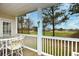 This covered patio has golf course views and outdoor seating to relax and unwind at 5050 Windsor Green Way # 203, Myrtle Beach, SC 29579