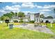 Community picnic area featuring several tables with lush greenery at 5050 Windsor Green Way # 203, Myrtle Beach, SC 29579