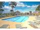 Resort-style pool for tenants to relax in lounge chairs and enjoy the weather at 5050 Windsor Green Way # 203, Myrtle Beach, SC 29579