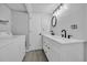 Renovated bathroom features double sinks, vanity, modern fixtures, and in-unit laundry area at 510 Rosemary Ln., North Myrtle Beach, SC 29582
