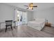 Bright bedroom featuring a ceiling fan, desk, and sliding glass door to a patio at 510 Rosemary Ln., North Myrtle Beach, SC 29582