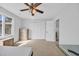 Spacious bedroom featuring a ceiling fan, neutral carpet, and generous closet space at 510 Rosemary Ln., North Myrtle Beach, SC 29582