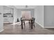 Bright dining area with a wooden table, black chairs, and sliding glass door at 510 Rosemary Ln., North Myrtle Beach, SC 29582