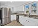 Modern kitchen with stainless steel appliances, white cabinets, and lots of counter space at 510 Rosemary Ln., North Myrtle Beach, SC 29582