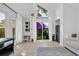 Bright living room featuring tile floors, large windows, and sliding glass doors to the outdoor area at 510 Rosemary Ln., North Myrtle Beach, SC 29582