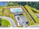 Aerial community view of the neighborhood pool and clubhouse, set amongst lush greenery at 520 Cattle Drive Circle, Myrtle Beach, SC 29588