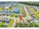 Neighborhood aerial view featuring a pond, well-kept lawns and mature trees at 520 Cattle Drive Circle, Myrtle Beach, SC 29588