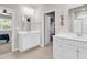 Bright and airy bathroom with double vanities, tile floors, and a walk-in closet at 520 Cattle Drive Circle, Myrtle Beach, SC 29588